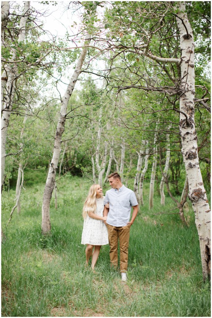 Couple laughing together in mountains. Photo by Utah Photographer Mary Horne Nelson.