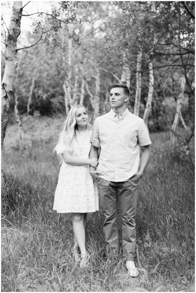 Black and White image of couple standing together in Utah Valley. Photo by Utah Photographer Mary Horne Nelson.