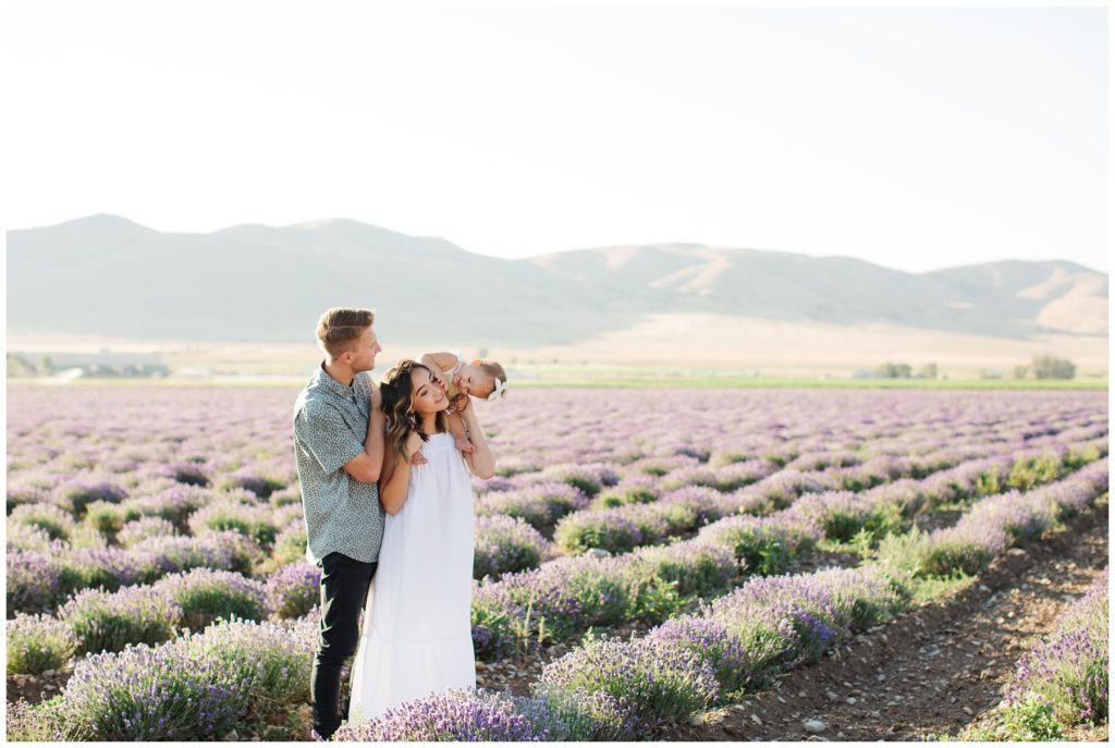 Daughter playing with mother in lavender field. Utah Lifestyle Family Session in the Young Living Lavender Fields. Mary Horne Nelson, 2021