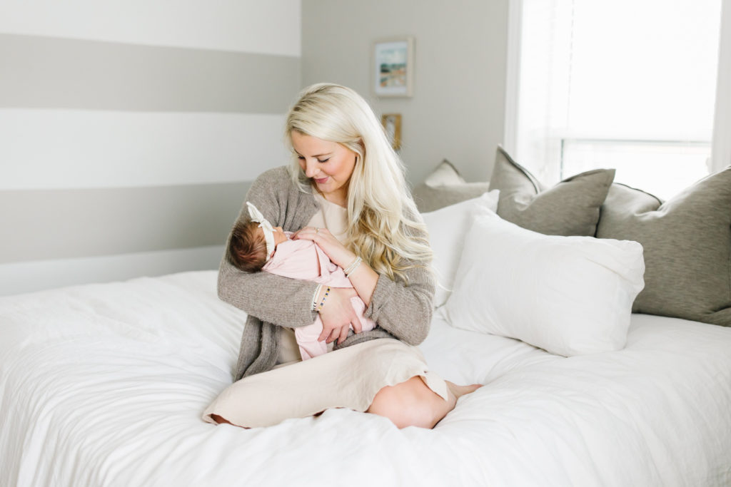 Photo of mom and newborn baby. In home newborn session.