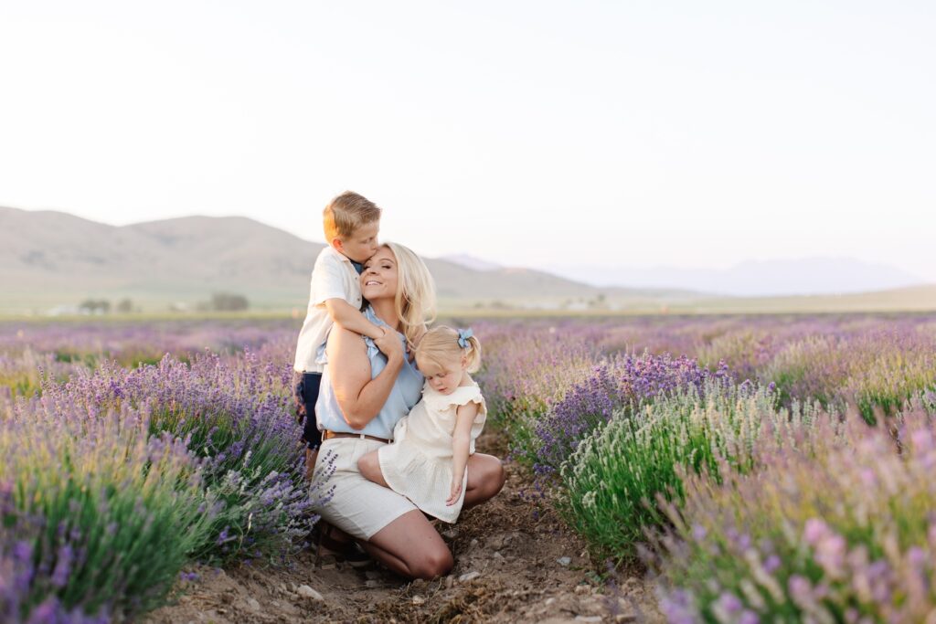 When do the lavender fields bloom in Utah? Son kissing mom's head in the middle of the lavender fields in Mona Utah.