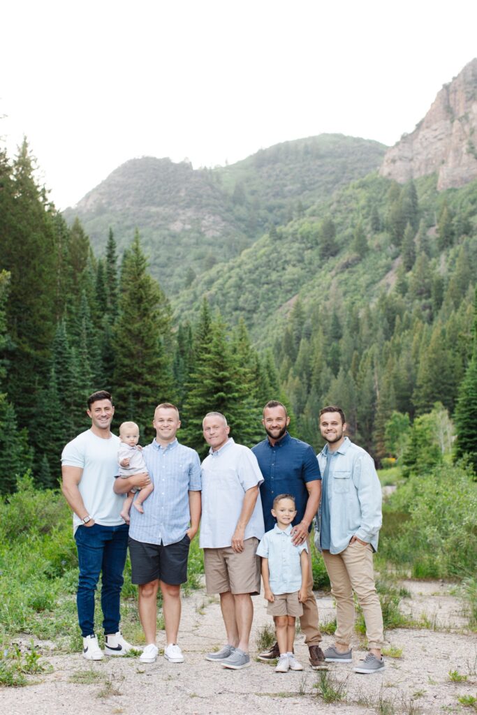 Extended Family Photography in Utah Mountains. Boys from the family standing together and smiling