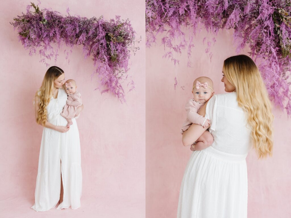 Mother and daughter under a floral installation. Utah Motherhood Photographer Mary Horne Nelson